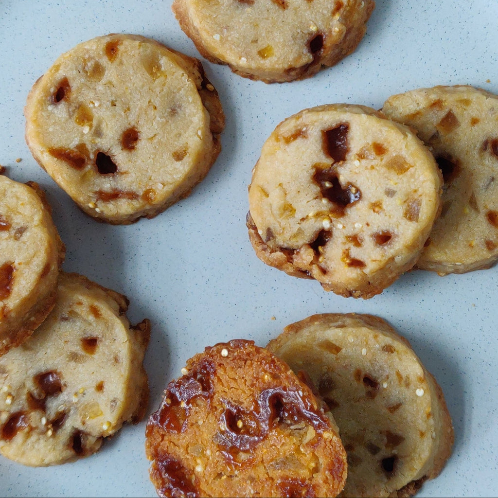 a plate of round orange toffee shortbread